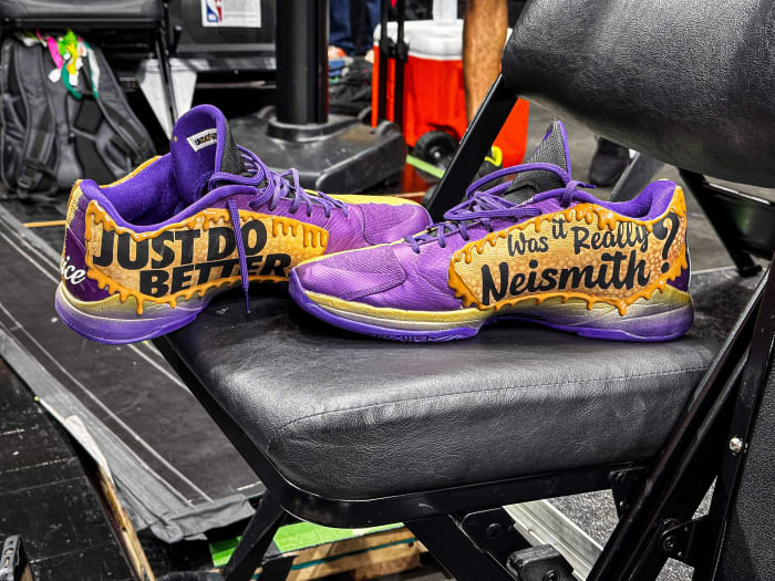View of Jaylen Brown's purple and brown shoes.